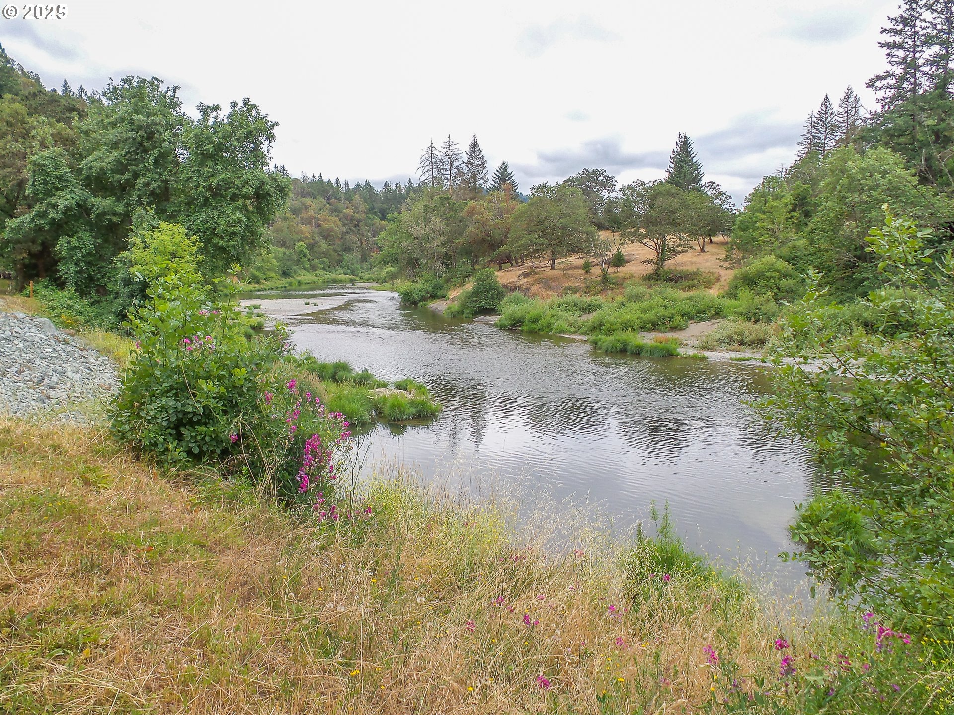 1138 Yokum Road Riddle, OR 97469 - Photo 27 of 33 a view of a lake view with houses in back