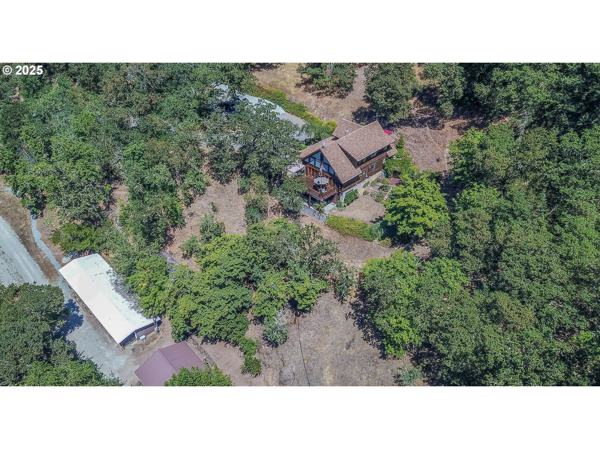 1138 Yokum Road Riddle, OR 97469 - Photo 29 of 33 a upper view of a house with a yard