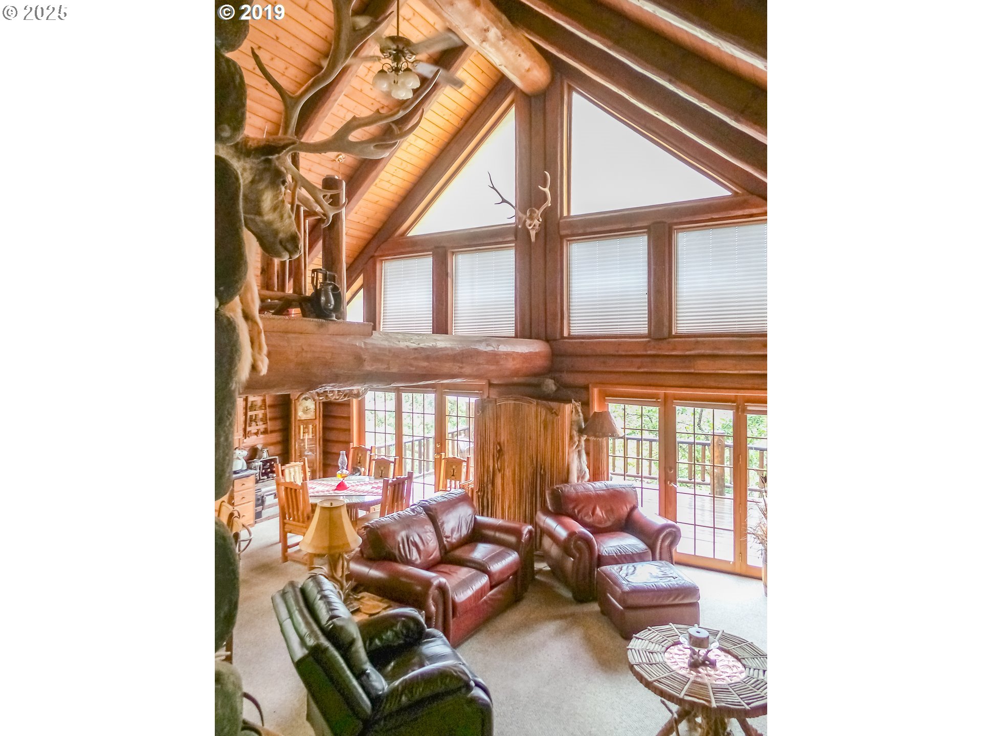 1138 Yokum Road Riddle, OR 97469 - Photo 4 of 33 a living room with furniture and a large window