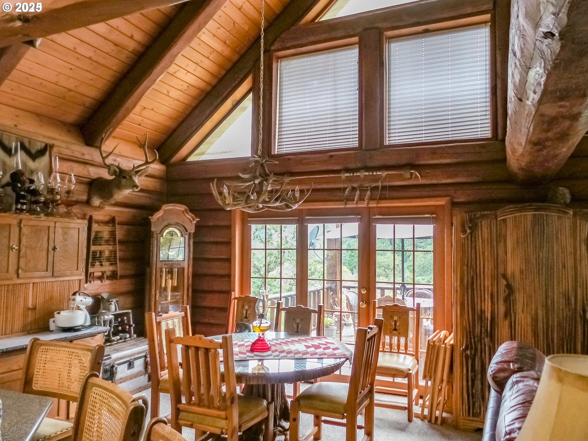 1138 Yokum Road Riddle, OR 97469 - Photo 7 of 33 a view of a dining room with furniture and chandelier