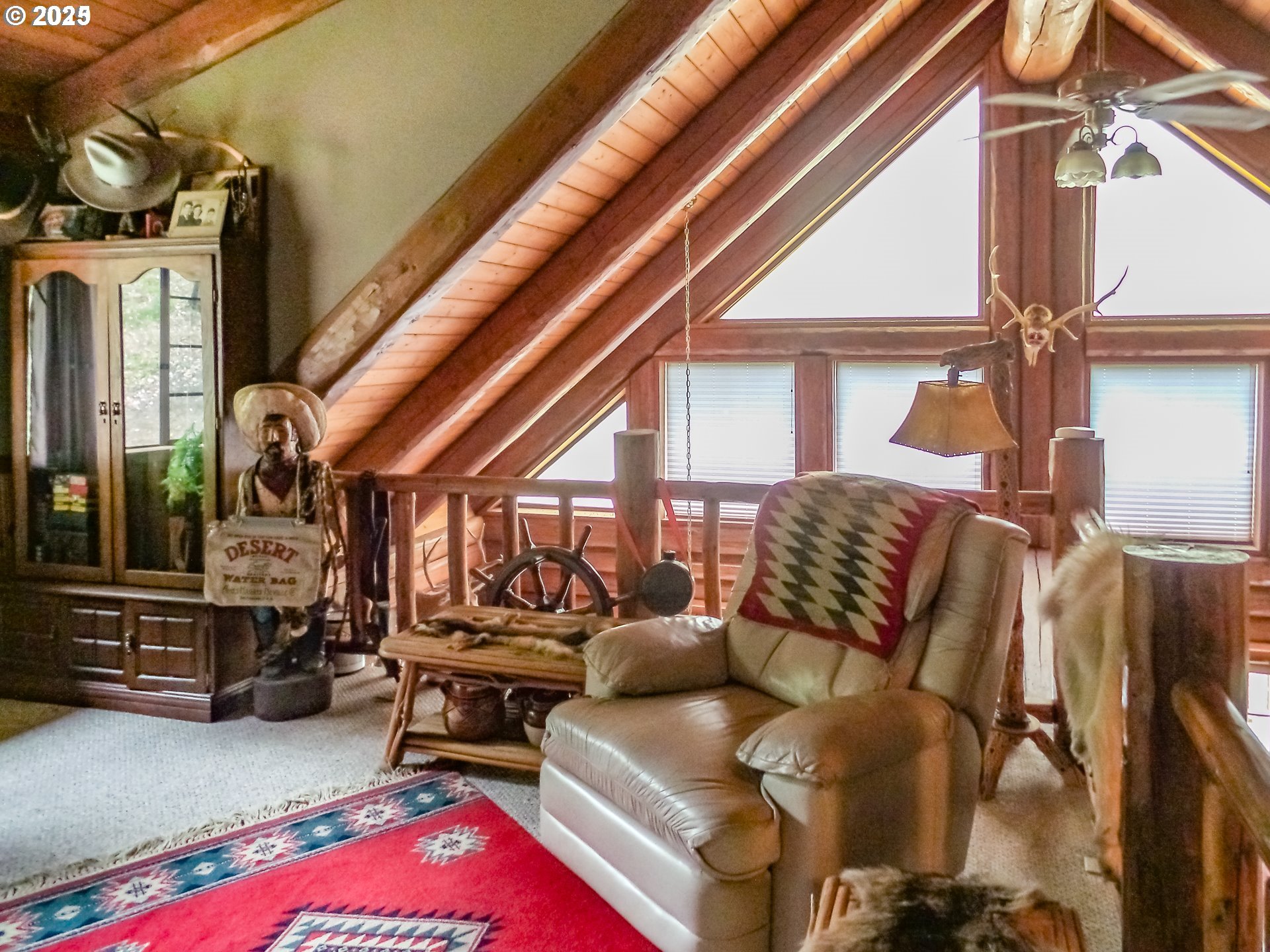 1138 Yokum Road Riddle, OR 97469 - Photo 8 of 33 a bedroom with furniture and a large window