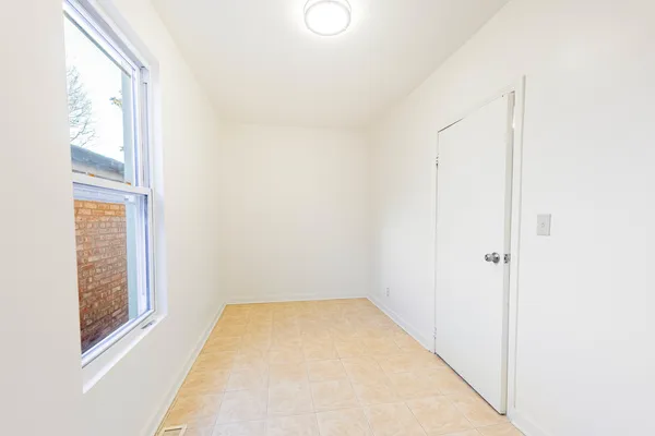 a view of an empty room with windows