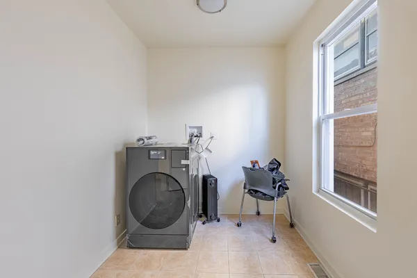 a view of livingroom with furniture washer and dryer