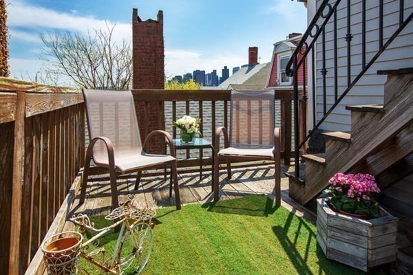 39 Mt Vernon Street, Unit 2 Boston, MA 02129 - Photo 8 of 9 a view of a chairs and table in the balcony