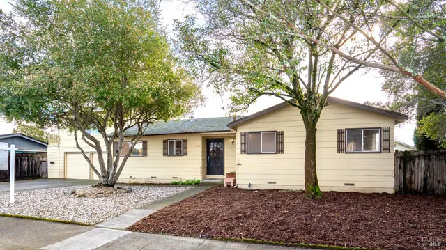 a house with trees in the background