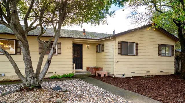 a view of a house with a yard