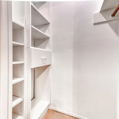 a view of staircase with white walls