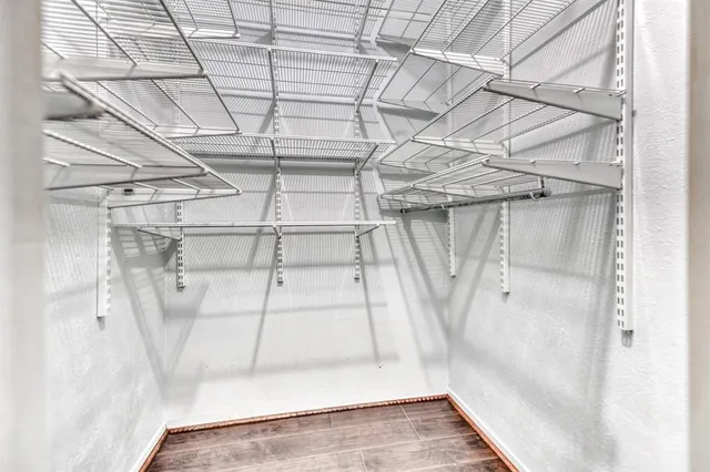 a view of a room with a white walls