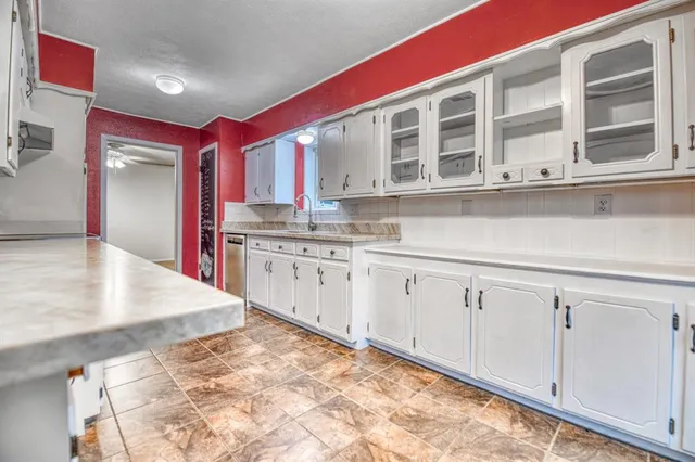 a kitchen with stainless steel appliances granite countertop a stove and a sink