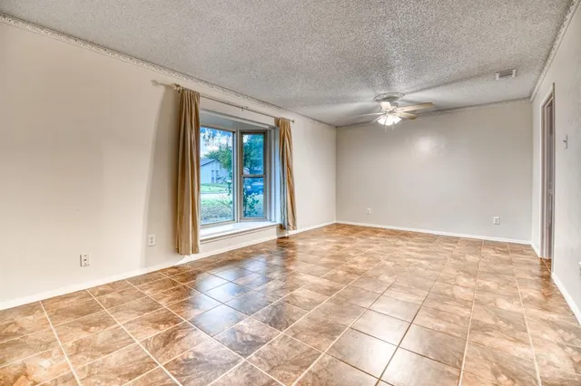 a view of an empty room with windows