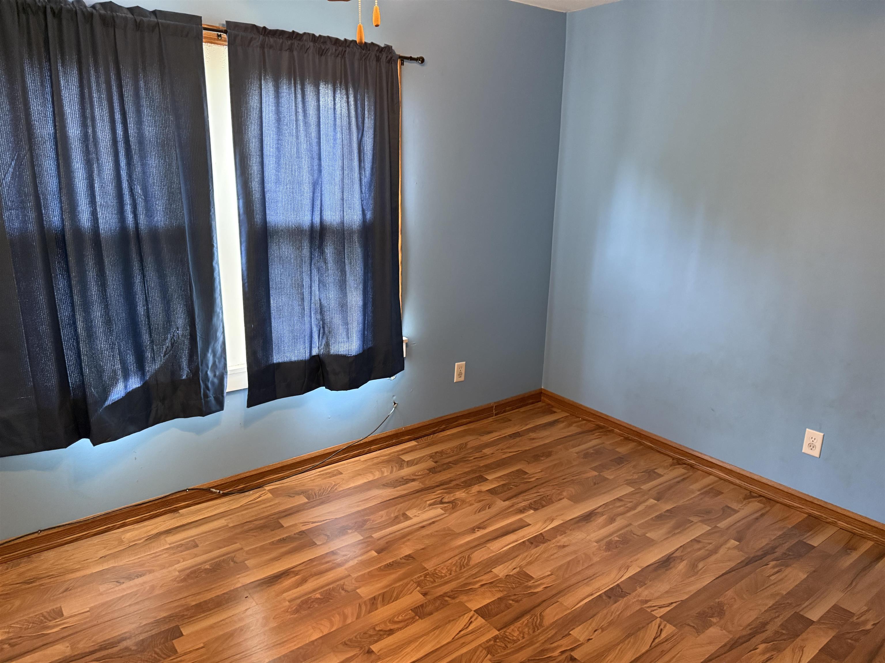 1473 South Float Avenue Freeport, IL 61032 - Photo 12 of 14 a view of an empty room with wooden floor