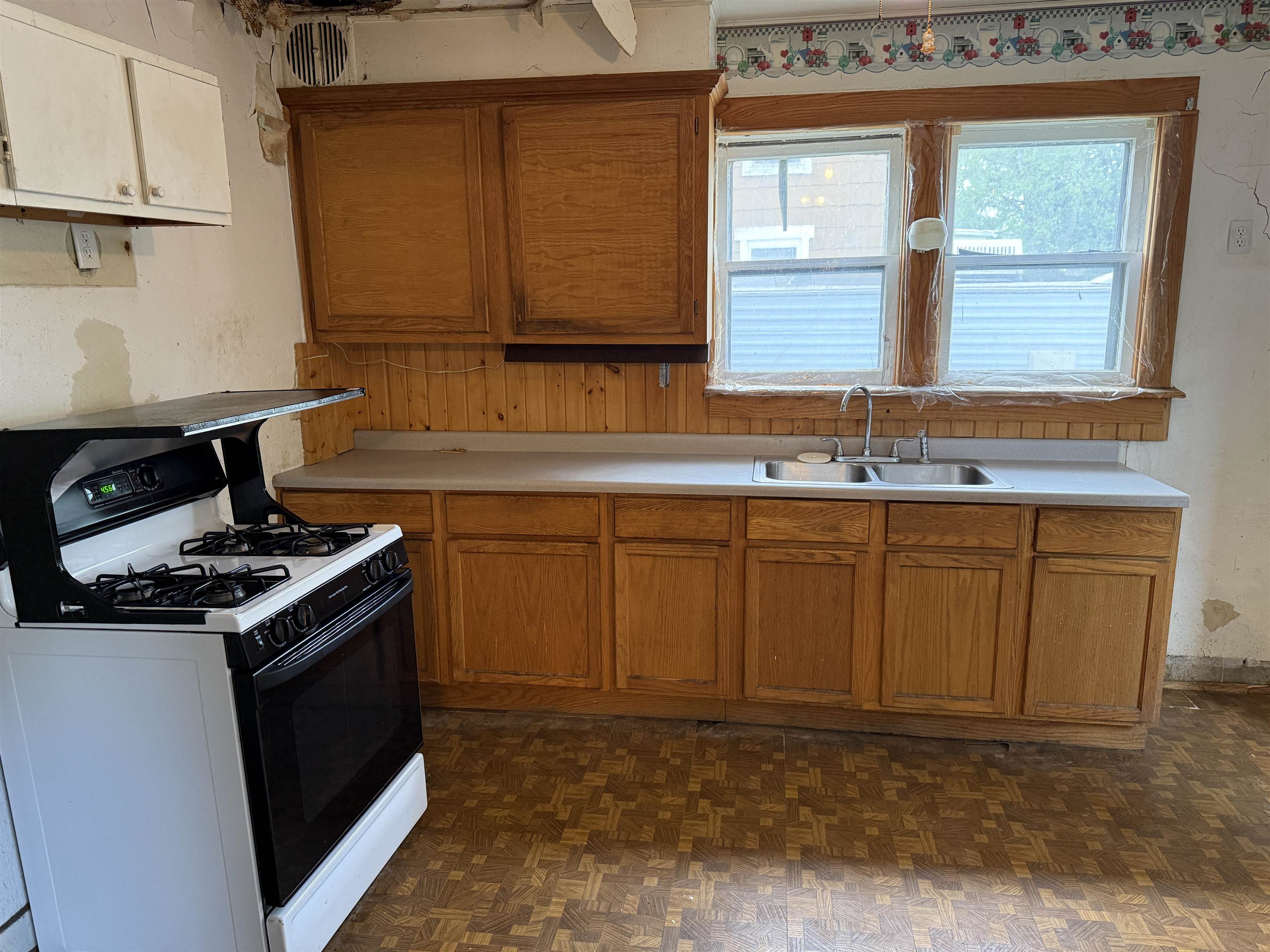 1473 South Float Avenue Freeport, IL 61032 - Photo 6 of 14 a kitchen with granite countertop a sink a stove and cabinets