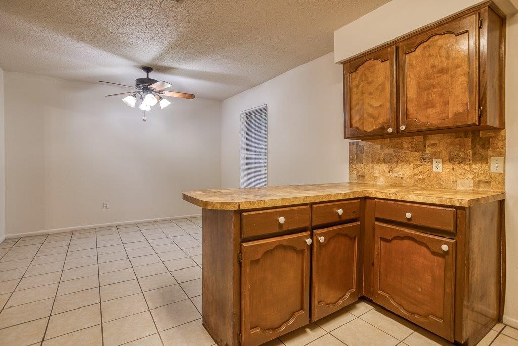 102 Timber Trail Circle Portland, TX 78374 - Photo 11 of 28 a view of a kitchen with a sink and cabinets