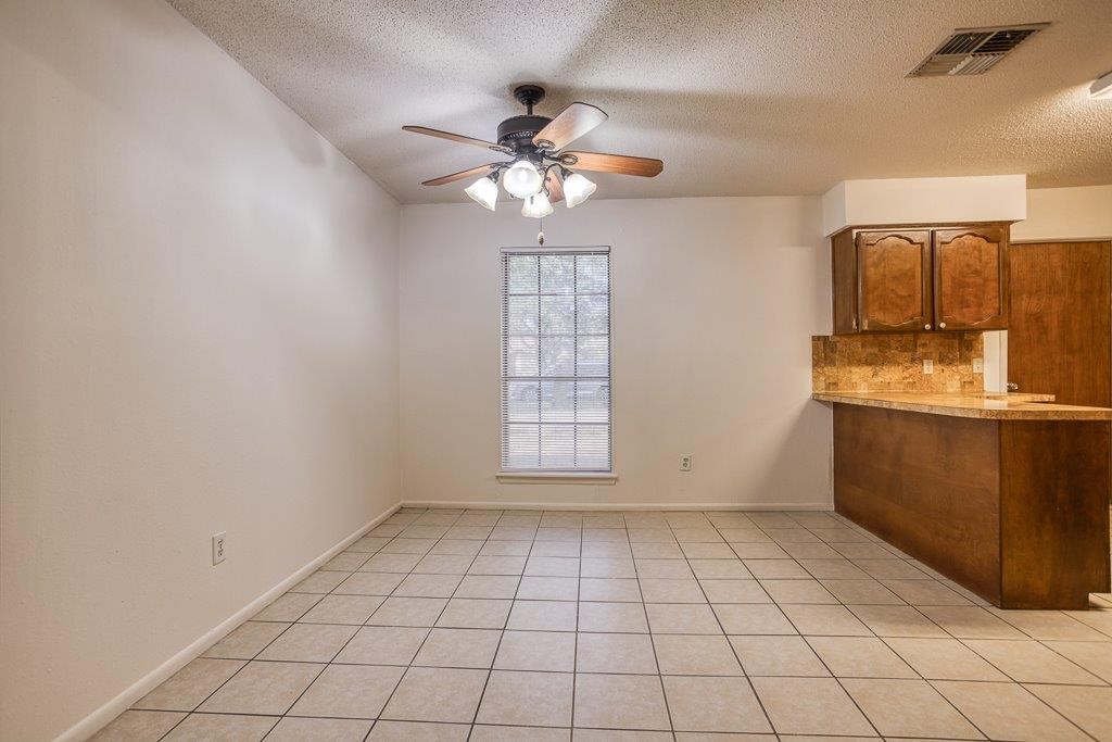 102 Timber Trail Circle Portland, TX 78374 - Photo 13 of 28 a view of an empty room with window and cabinet