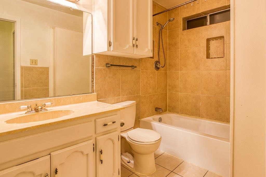102 Timber Trail Circle Portland, TX 78374 - Photo 18 of 28 a bathroom with a sink a toilet and shower