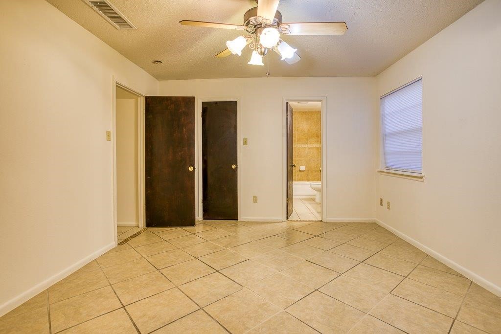 102 Timber Trail Circle Portland, TX 78374 - Photo 24 of 28 a view of an empty room with window and chandelier fan