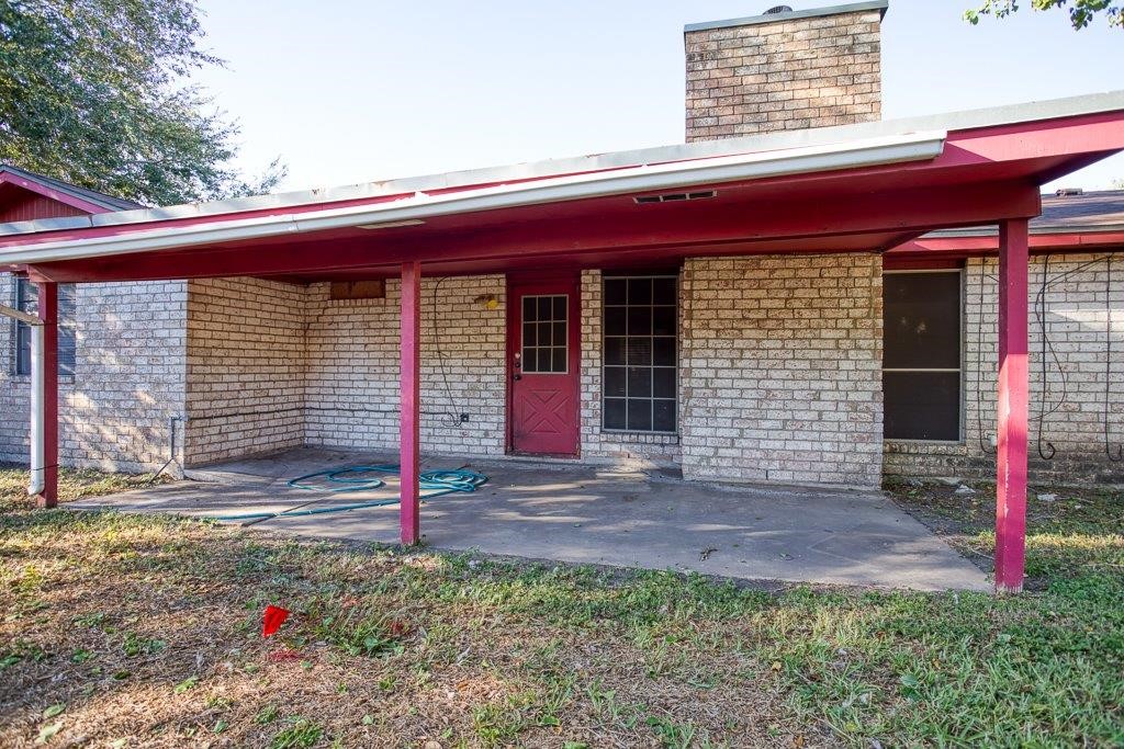 102 Timber Trail Circle Portland, TX 78374 - Photo 26 of 28 a front view of a house with garden