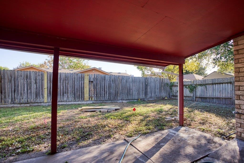 102 Timber Trail Circle Portland, TX 78374 - Photo 27 of 28 a view of a backyard with a sink and wooden fence