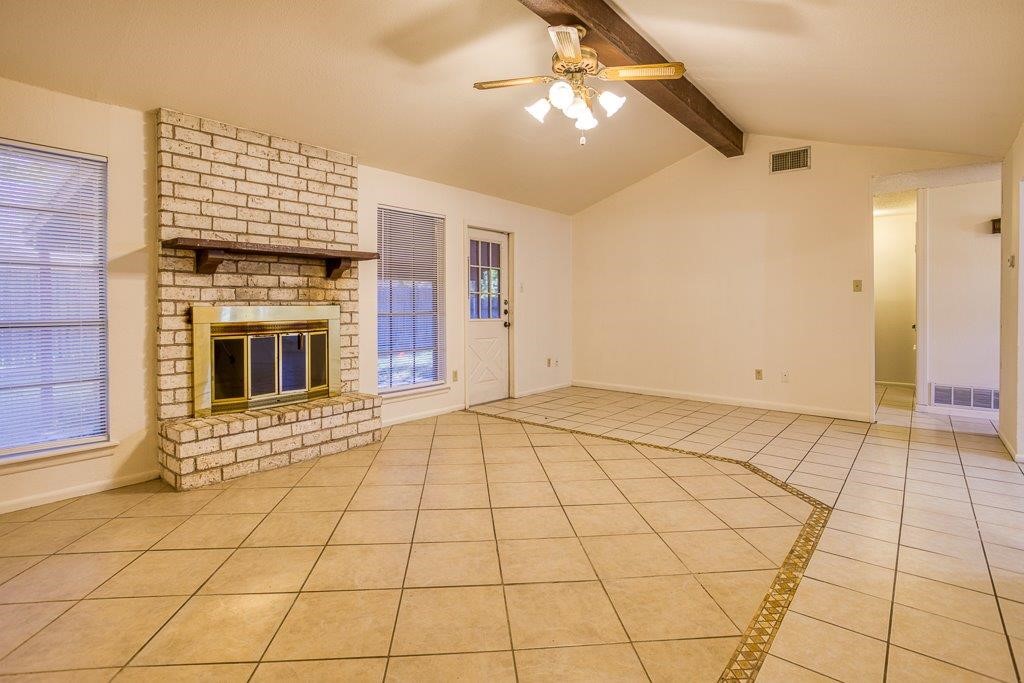 102 Timber Trail Circle Portland, TX 78374 - Photo 8 of 28 a view of an empty room with chandelier fan and fireplace