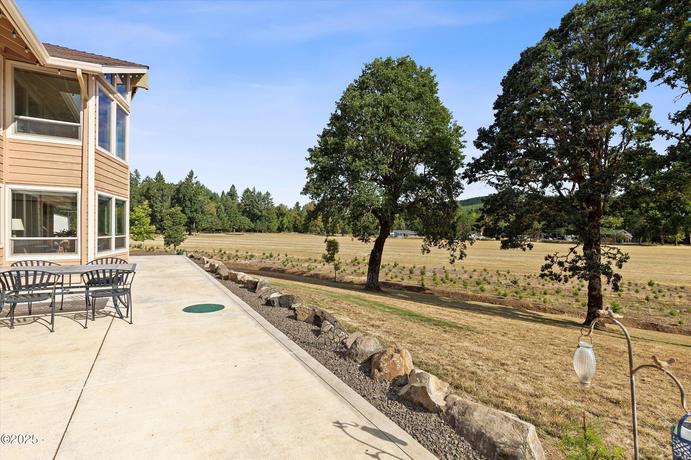 21560 Gooseneck Road Sheridan, OR 97378 - Photo 49 of 63 a view of a yard with wooden fence