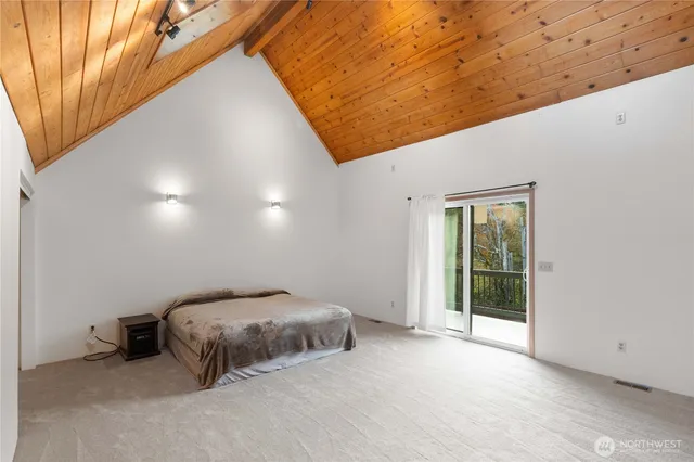 a view of a bathtub & dryer in a room