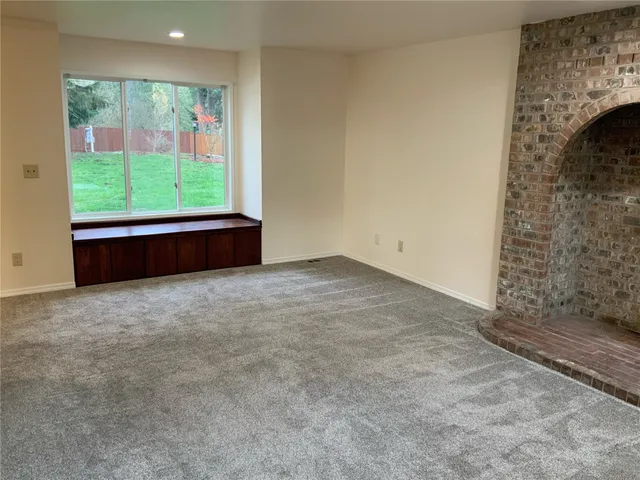 a kitchen with stainless steel appliances granite countertop a refrigerator stove and sink
