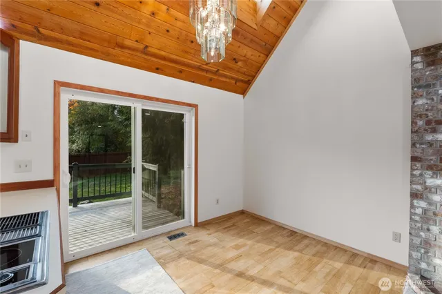a view of a kitchen with granite countertop a sink and a counter top space