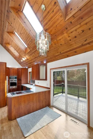 a view of a room with a kitchen