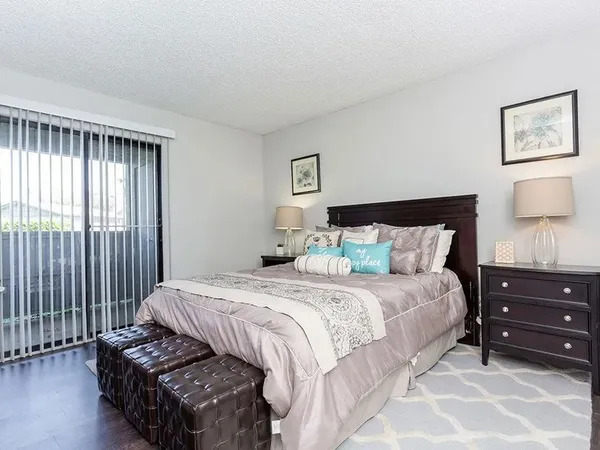 a bed room with a bed and a window