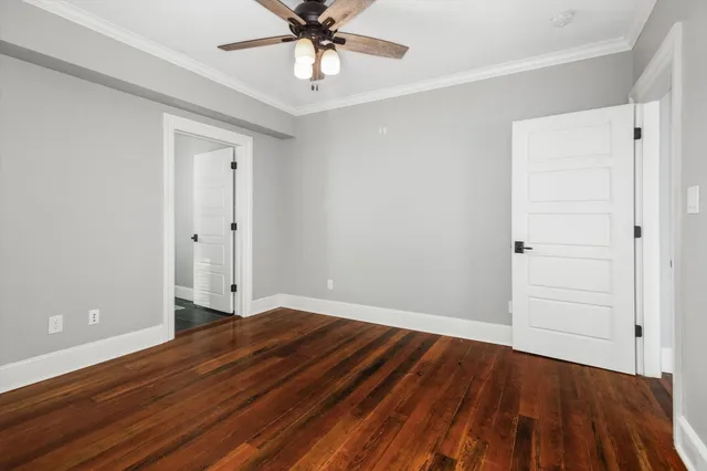 a spacious bathroom with a double vanity sink a mirror and a bathtub