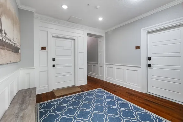 a living room with a bed and a window