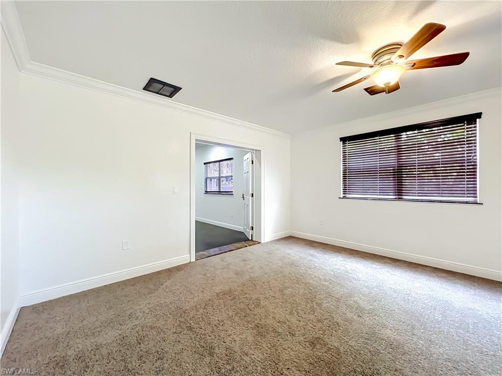 4200 South Hiawassee Road Orlando, FL 32835 - Photo 21 of 47 an empty room with windows and fan