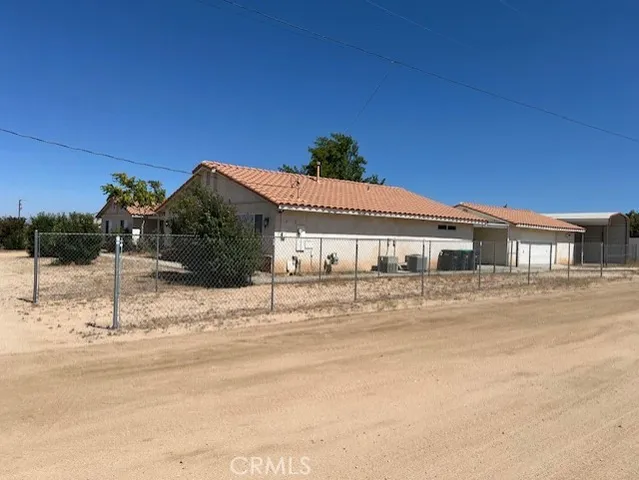 a view of a house with a snow on the road
