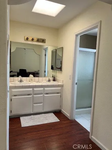 a bathroom with a sink and a mirror