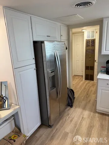 a kitchen with a stove a sink and a microwave