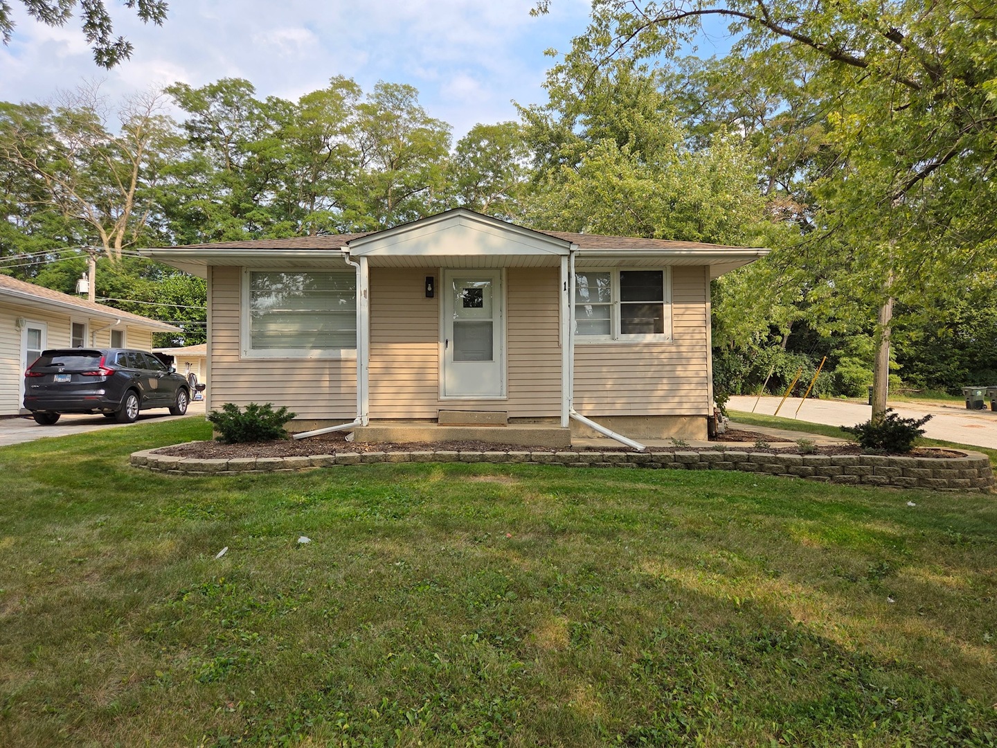 1 Stone Avenue North Aurora, IL 60542 - Photo 1 of 1 a front view of house with yard and green space