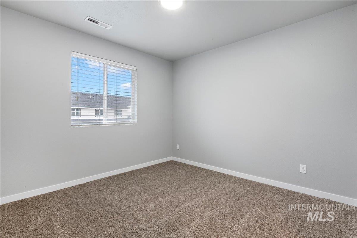 2513 East Goldstone Street Meridian, ID 83642 - Photo 15 of 27 Carpeted empty room featuring baseboards
