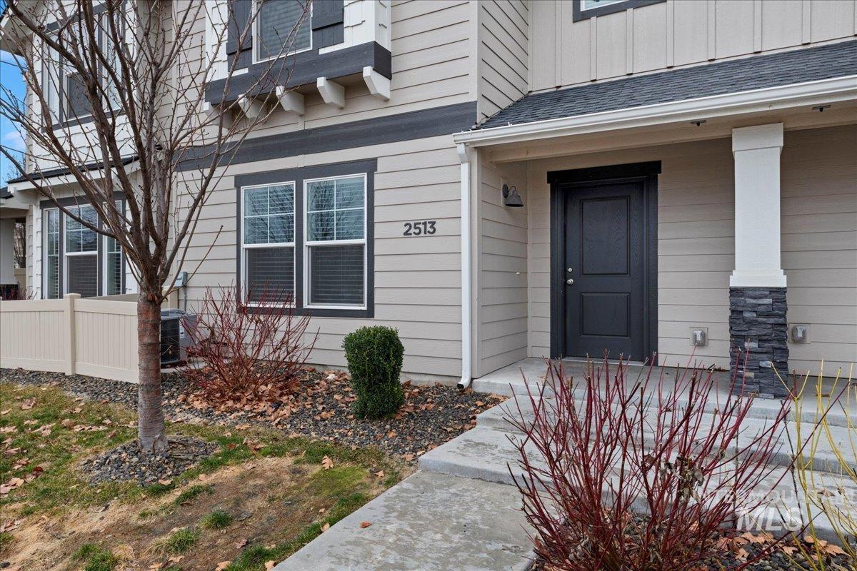 2513 East Goldstone Street Meridian, ID 83642 - Photo 3 of 27 Property entrance featuring board and batten siding and roof with shingles