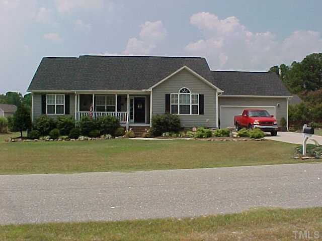7219 Sunset View Court Willow Spring, NC 27592 - Photo 1 of 24 LOW MAINTENANCE, SPLIT BEDROOM PLAN, TWO CAR GARAGE HAS WORKSHOP AREA AND BENCHES