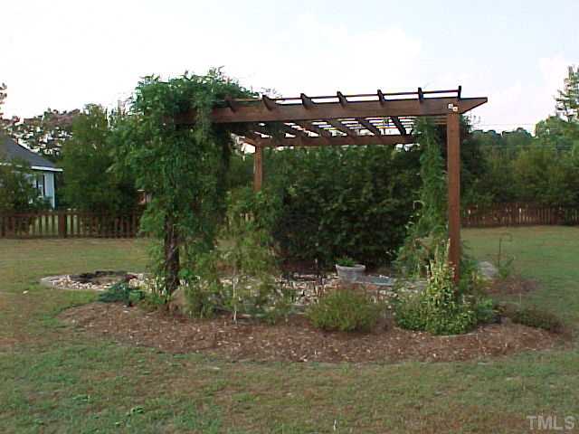 7219 Sunset View Court Willow Spring, NC 27592 - Photo 21 of 24 LOVELY PERGOLA