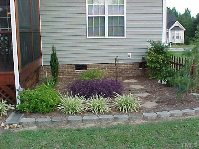 7219 Sunset View Court Willow Spring, NC 27592 - Photo 3 of 24 BACKYARD PLANT GARDEN
