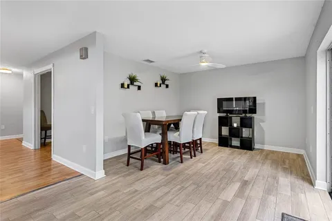 a view of a livingroom with furniture and wooden floor
