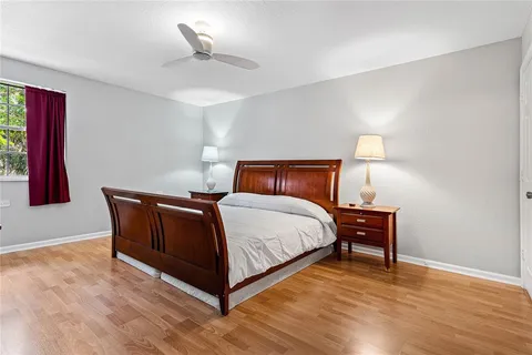 a bedroom with a bed and a lamp
