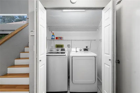 a utility room with dryer and washer