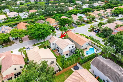an aerial view of residential house with outdoor space and street view