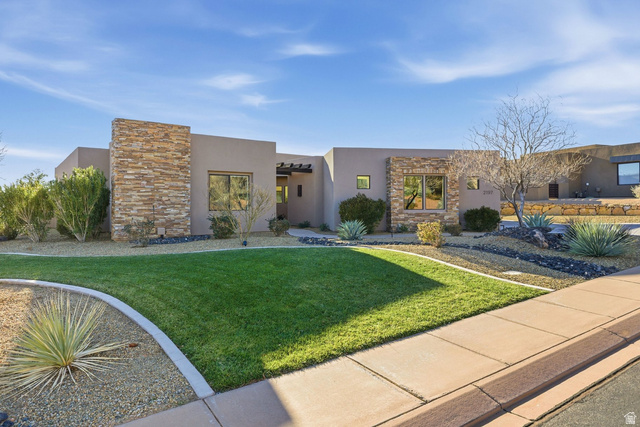 2197 Reserve Circle St. George, UT 84770 - Photo 5 of 57 View of front of property with stone siding, stucco siding, and a front yard