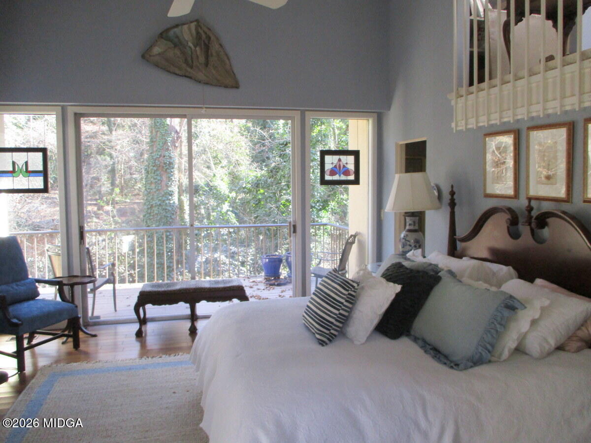 1121 South Jackson Springs Road Macon, GA 31211 - Photo 20 of 29 a spacious bedroom with a bed and a large window