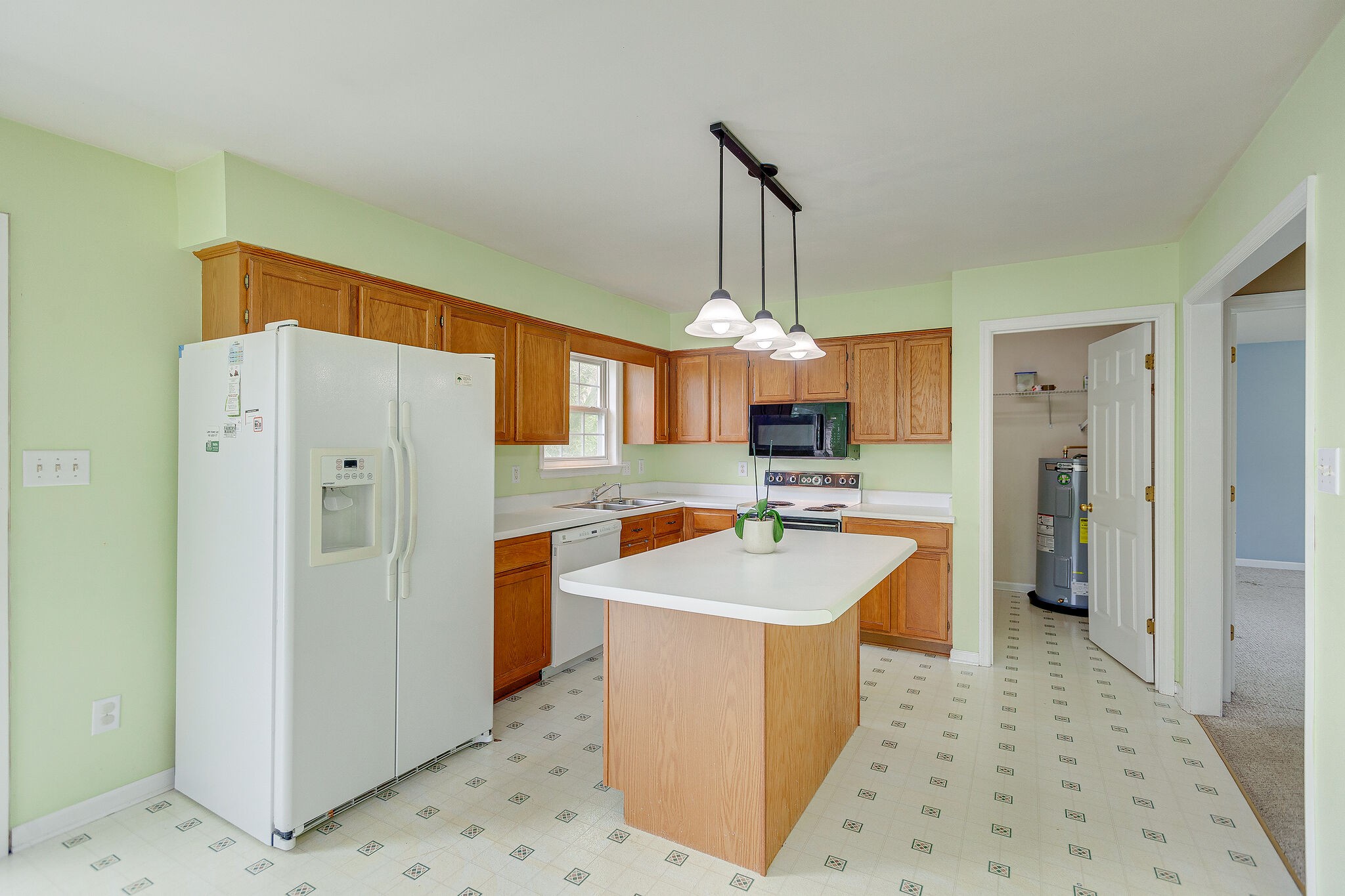3668 Rutherford Drive Spring Hill, TN 37174 - Photo 11 of 31 a large kitchen with cabinets