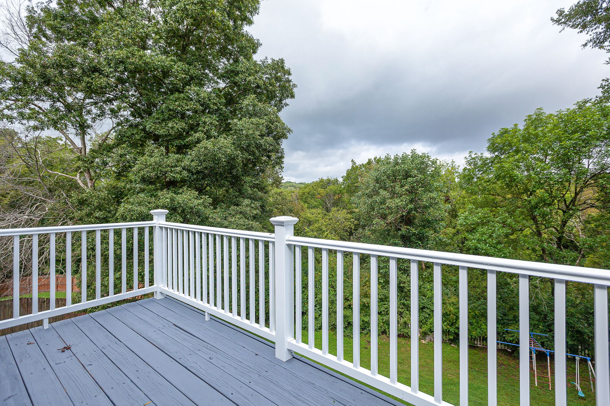3668 Rutherford Drive Spring Hill, TN 37174 - Photo 24 of 31 a balcony with wooden floor and fence