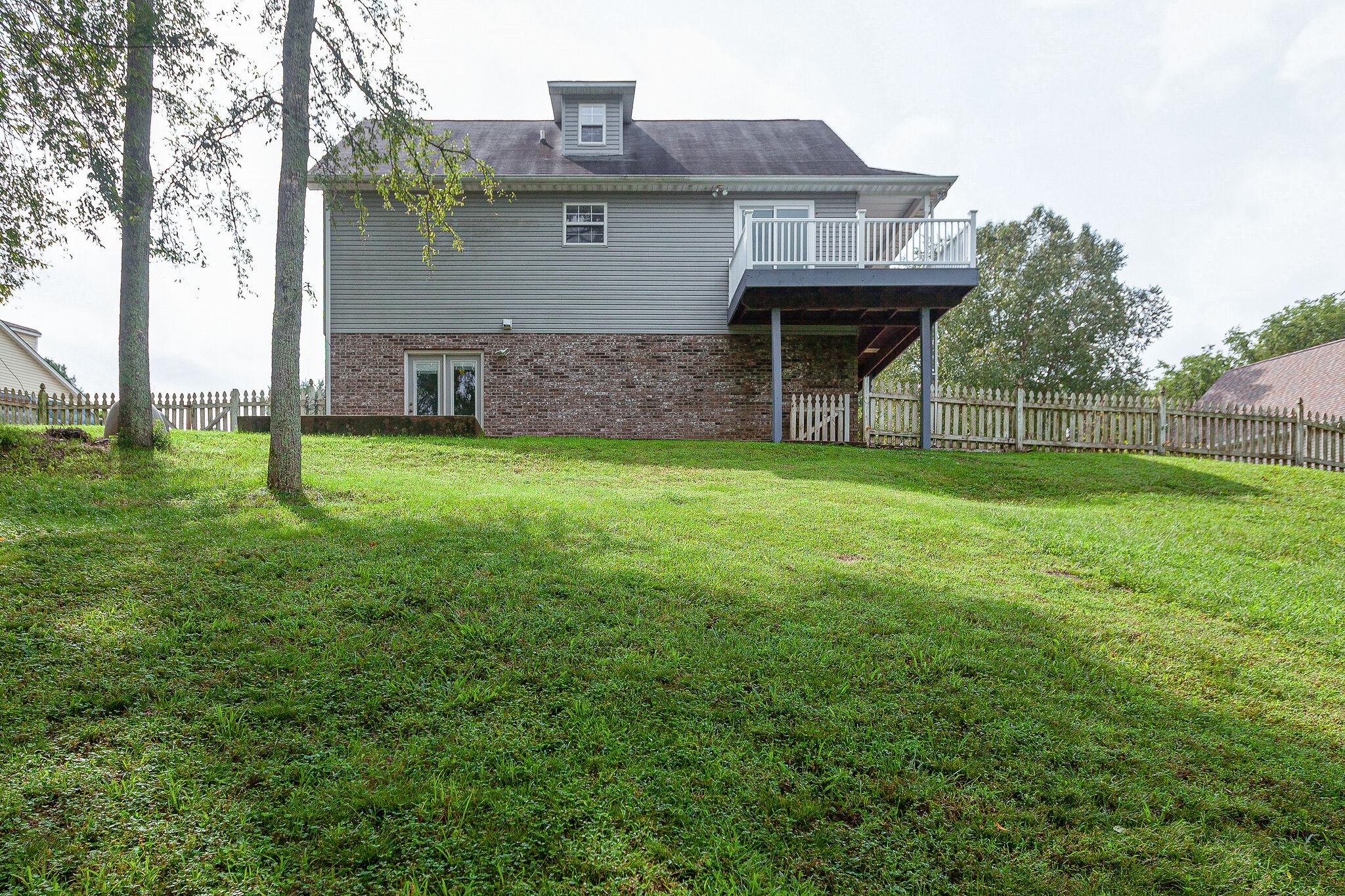 3668 Rutherford Drive Spring Hill, TN 37174 - Photo 30 of 31 a front view of a house with a garden